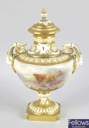 A Royal Worcester bone china twin handled vase and cover by Harry Stinton.