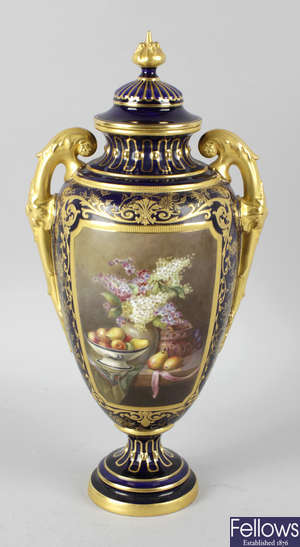 A Royal Worcester bone china twin handled vase and cover.