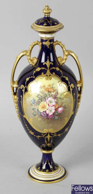 A Royal Crown Derby bone china twin handled vase and cover.