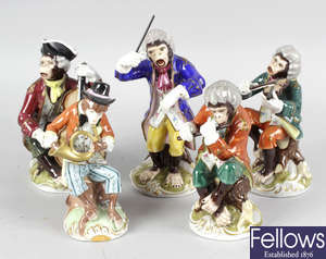 A group of five Continental porcelain figures, each modelled as monkey bandsmen.