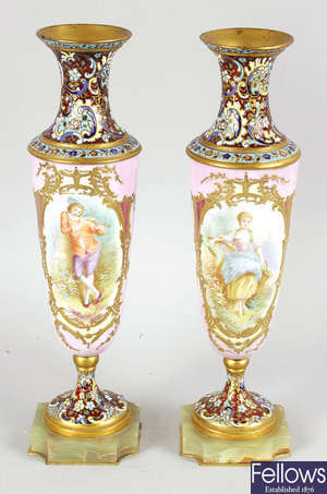 A pair of 19th Century porcelain and enamel vases of slender tapered form.