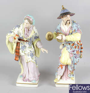 A pair of large German porcelain figurines.