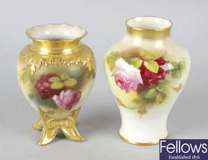 A Royal Worcester bone china vase hand painted with roses, together with another similar vase.
