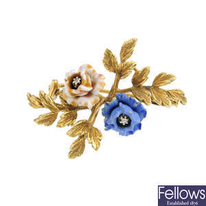 A diamond and enamel floral brooch.