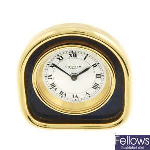 A gold plated desk clock by Cartier.