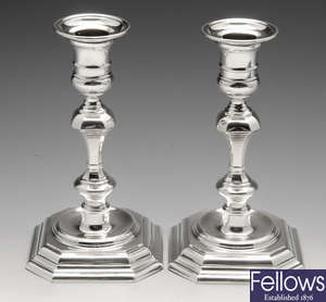 A modern pair of silver mounted candlesticks.