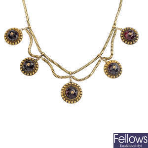 A mid Victorian gold garnet necklace.