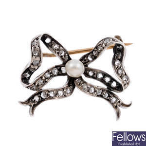 An early 20th century diamond and cultured pearl bow brooch.