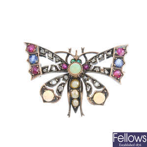 An early 20th century gold and silver gem-set butterfly brooch.
