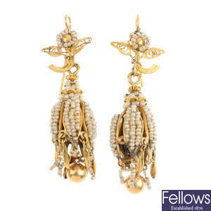 A pair of seed pearl earrings.