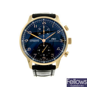 IWC - a gentleman's 18ct rose gold Portuguese chronograph wrist watch.