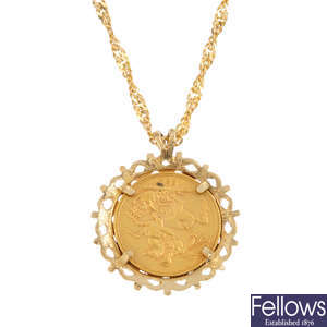 A 9ct gold mounted Victorian sovereign pendant, with chain.