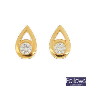 A pair of 18ct gold diamond stud earrings.