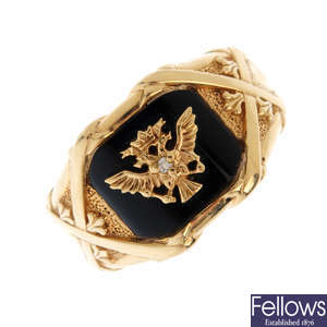 A gentleman's 14ct gold diamond and onyx ring.