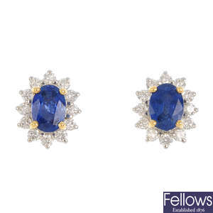 A pair of sapphire and diamond earrings.