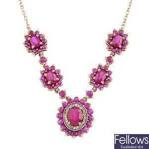 A silver glass-filled ruby and gem-set necklace.