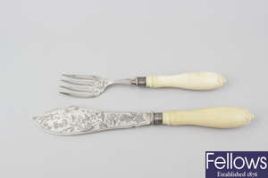A pair of Victorian Aesthetic period ivory-handled silver fish servers.