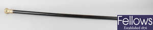 American interest: a late 19th century ebonised and gilt metal walking stick or cane.