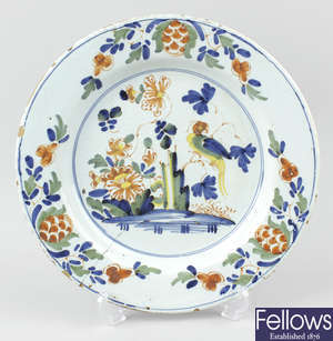 A mid 18th century English polychrome delftware plate.