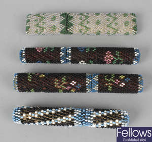 Four late 19th century beadwork decorated needle cases and covers.