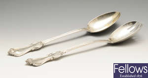 A pair of early Victorian matched silver salad servers.