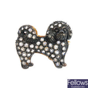 A moonstone dog brooch.