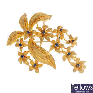 A sapphire floral brooch.