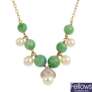 A pair of jade and gem-set earrings and a necklace.