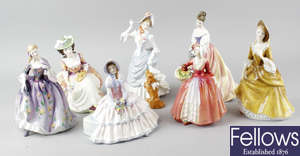 A group of seven Royal Doulton figurines.