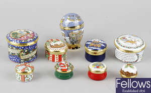 A group of Halcyon Days and other Christmas themed enamel boxes.
