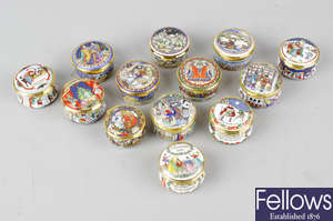 A group of Halcyon Days and other Christmas themed enamel boxes.
