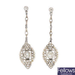 A pair of seed pearl and diamond earrings.