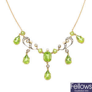 An early 20th century peridot, diamond and seed pearl necklace.
