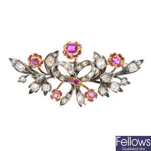 A mid Victorian silver and gold ruby and diamond floral brooch.