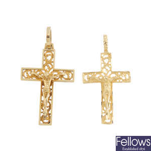 Two crucifix pendants.