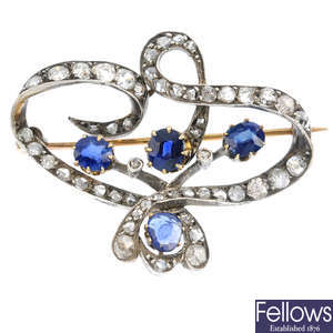 An Art Nouveau silver and gold, sapphire and diamond brooch.