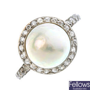 An early 20th century platinum, pearl and diamond ring.