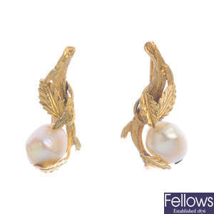 A pair of pearl earrings.