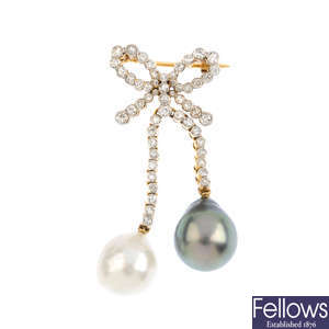 A diamond and cultured pearl bow brooch.