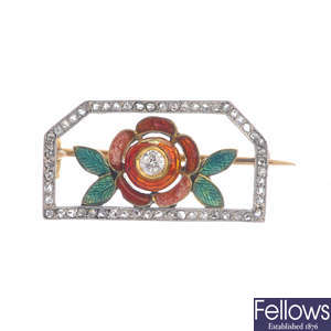 An early 20th century enamel and diamond set floral panel brooch.