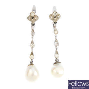 A pair of mid 20th century pearl and diamond earrings.
