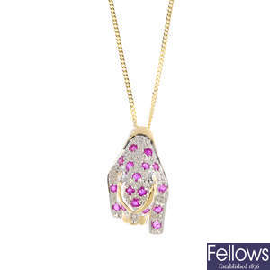 A 9ct gold ruby and diamond leopard pendant, with 9ct gold chain.