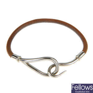 HERMÈS - a leather cord bracelet.