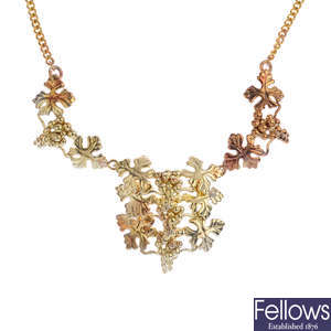 A 9ct gold grape and vine necklace.