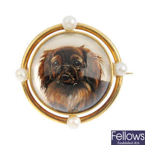 An early 20th century gold gem-set reverse-carved intaglio brooch.