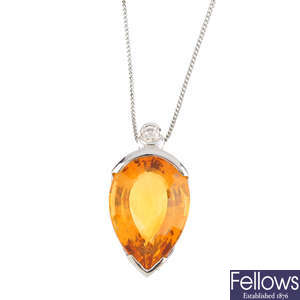 A citrine and diamond pendant, with an 18ct gold chain.