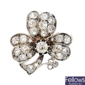 A late Victorian silver and gold diamond shamrock brooch.