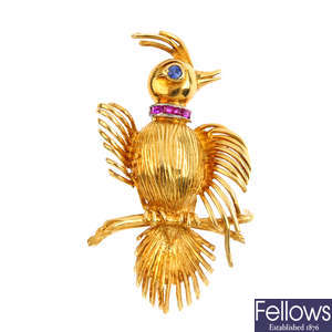 A 1970s 18ct gold sapphire and ruby bird brooch.