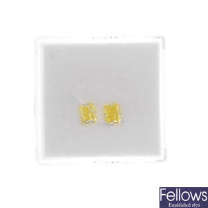 Two loose natural fancy diamonds.