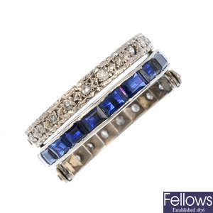 A sapphire, ruby and diamond full eternity flip ring.